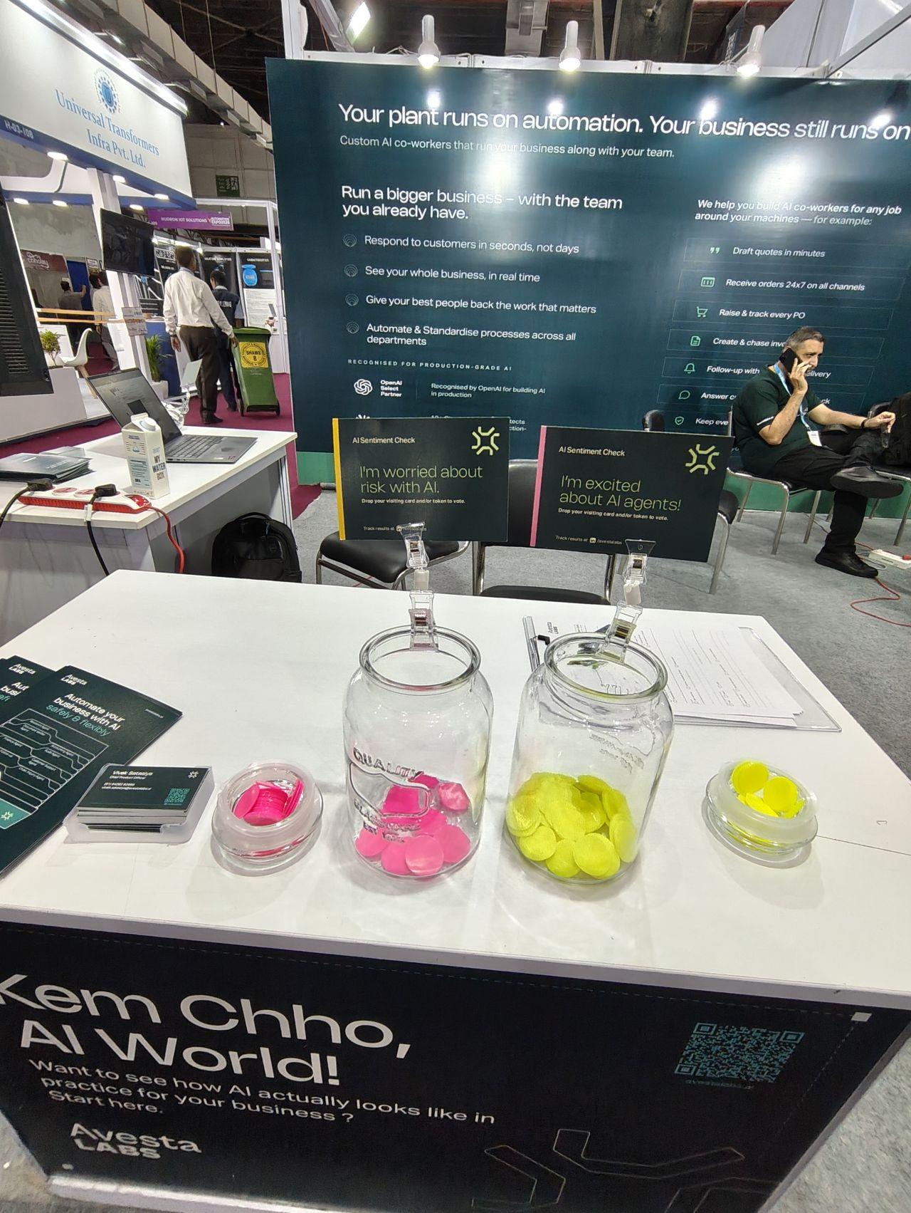 Two glass jars used for the AI sentiment poll at the Avesta Labs stand, one labelled for risk and one for excitement
