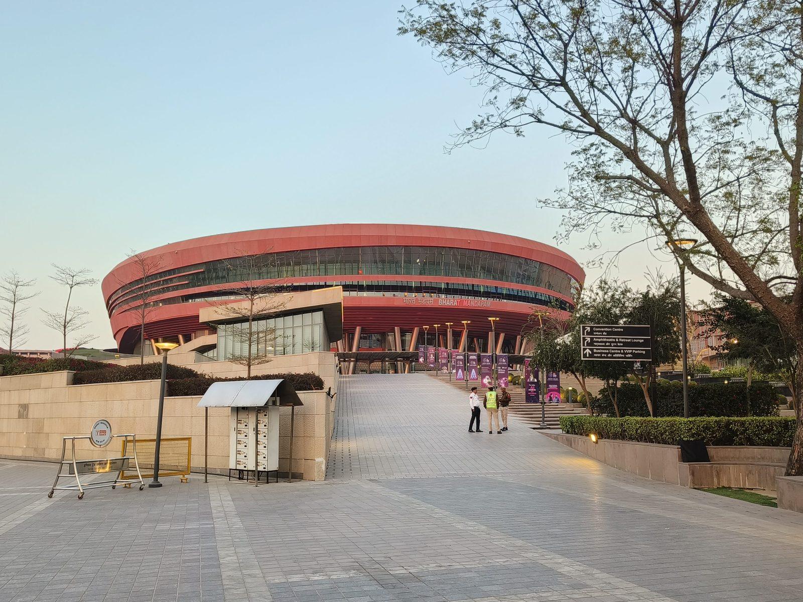 The Bharat Mandapam convention centre in New Delhi at dusk, host venue of the India AI Impact Summit 2026